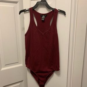 Dynamite body suit with button clasps